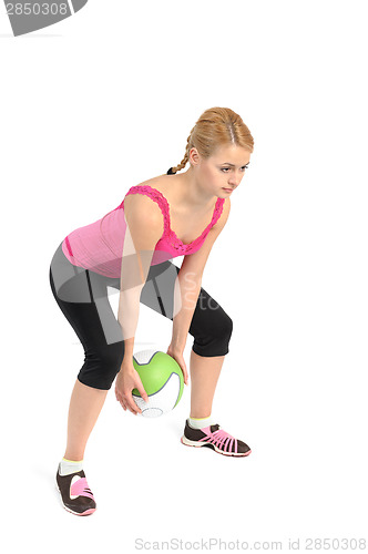 Image of Young lady doing medicine ball workout