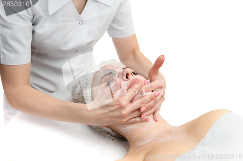 Image of facial massage with scrub mask 