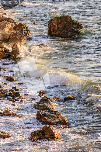 Image of Sea tide in rays of sunset