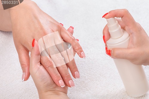 Image of manicure applying - moisturising