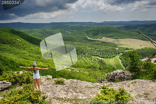 Image of Young woman against the storm