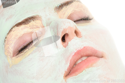 Image of beauty salon, closeup of facial mask applied