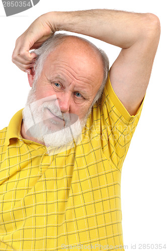 Image of balding senior man skratching his other ear