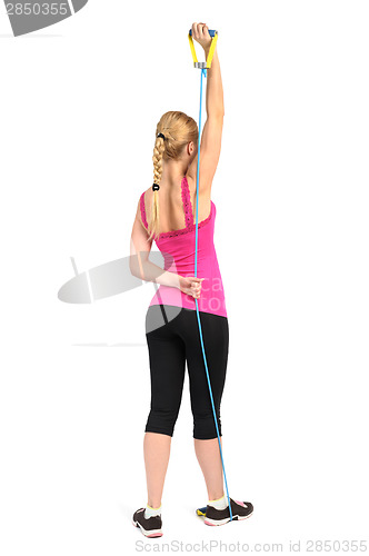 Image of Female triceps extention exercise using rubber resistance band