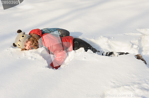 Image of young girl playing in snow