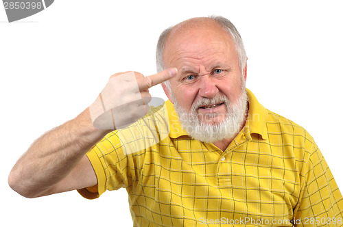 Image of senior bald man shows middle finger