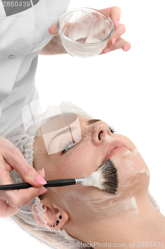 Image of beauty salon, facial mask applying