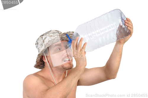 Image of young man looking into empty bottle