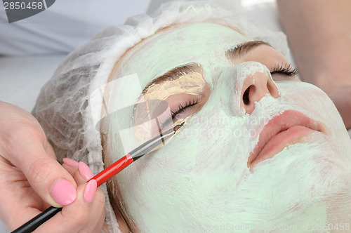 Image of beauty salon, facial mask applying