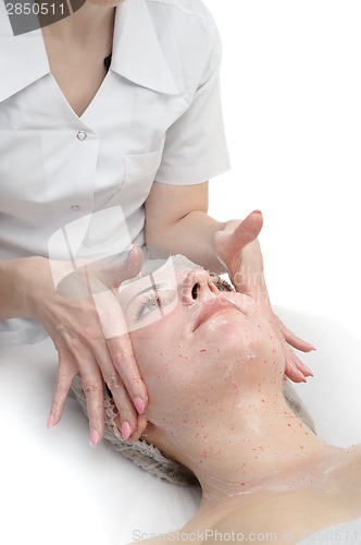 Image of facial massage with scrub mask 