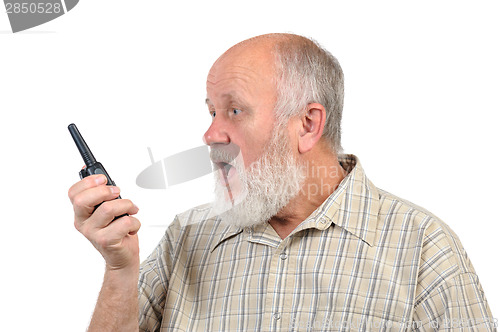 Image of senior bald man talking using walkie-talkie