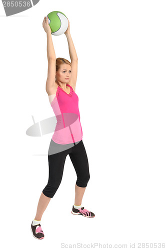 Image of Young lady doing medicine ball workout