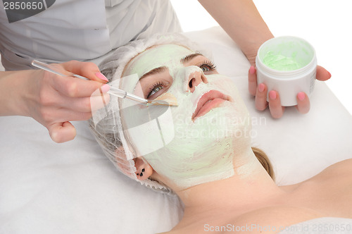 Image of beauty salon, facial mask applying