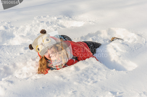 Image of young girl playing in snow