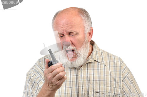 Image of senior bald man talking using walkie-talkie