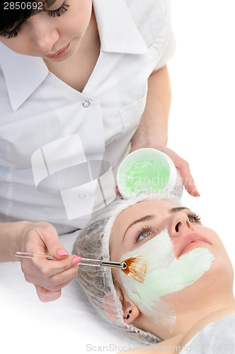 Image of beauty salon, facial mask applying