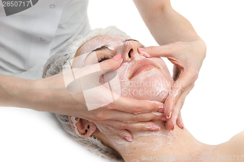 Image of facial massage with scrub mask 