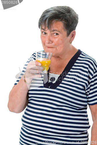 Image of Senior woman drinking orange juice