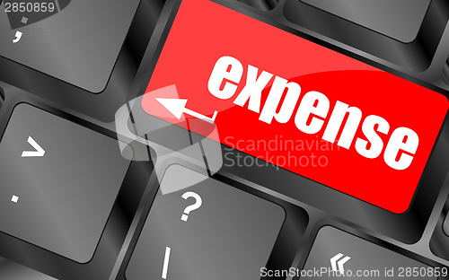 Image of expense button on the keyboard close-up