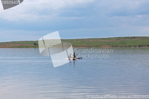 Image of Surfers and fishermans simultaneously