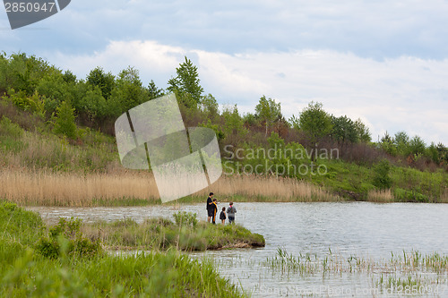 Image of Family fishing on a lake