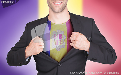 Image of Businessman opening suit to reveal shirt with flag