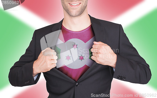 Image of Businessman opening suit to reveal shirt with flag