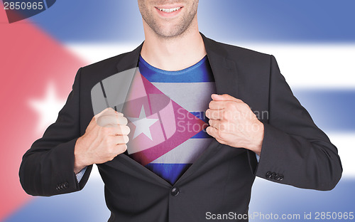 Image of Businessman opening suit to reveal shirt with flag