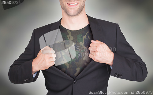 Image of Businessman opening suit to reveal shirt
