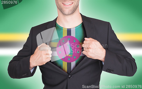 Image of Businessman opening suit to reveal shirt with flag