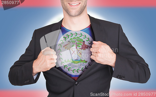 Image of Businessman opening suit to reveal shirt with flag