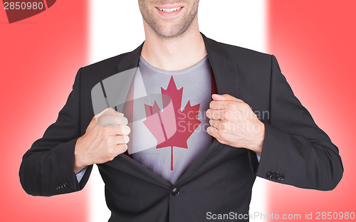 Image of Businessman opening suit to reveal shirt with flag