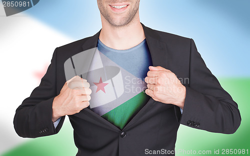 Image of Businessman opening suit to reveal shirt with flag