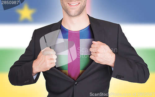 Image of Businessman opening suit to reveal shirt with flag