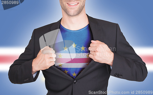 Image of Businessman opening suit to reveal shirt with flag