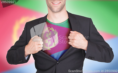 Image of Businessman opening suit to reveal shirt with flag