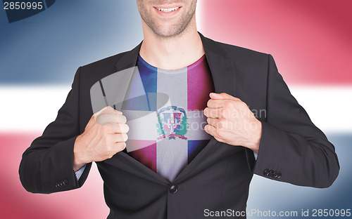 Image of Businessman opening suit to reveal shirt with flag