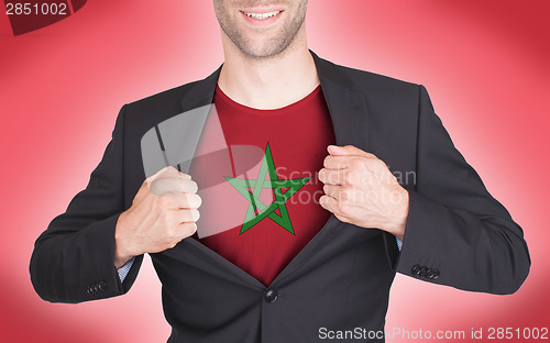 Image of Businessman opening suit to reveal shirt with flag