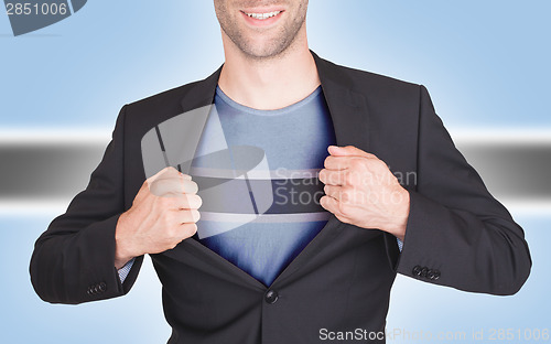 Image of Businessman opening suit to reveal shirt with flag