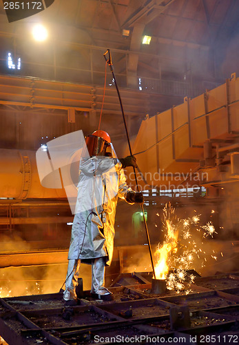 Image of worker with hot steel
