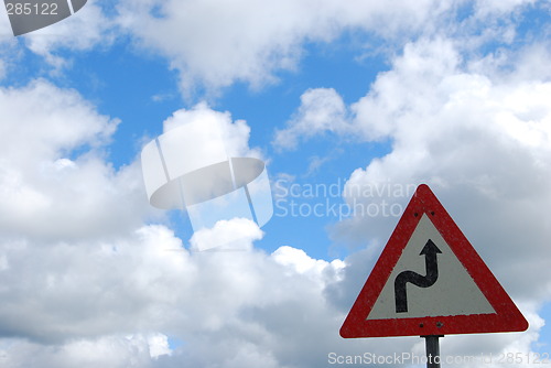 Image of Roadsign.Winding road.