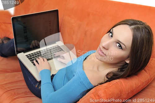 Image of woman using a laptop computer at home