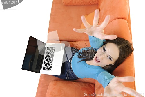 Image of woman using a laptop computer at home