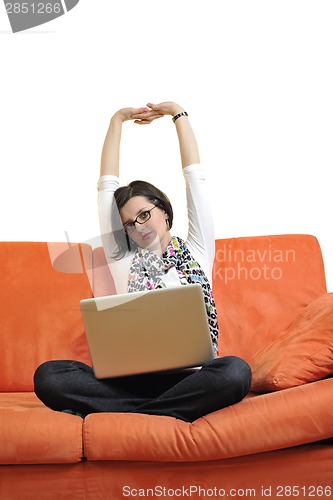 Image of woman using a laptop computer at home