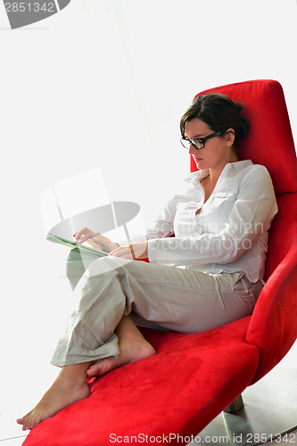 Image of woman using tablet pc at home