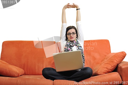 Image of woman using a laptop computer at home