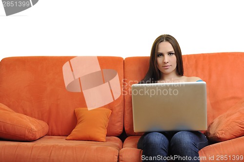 Image of woman using a laptop computer at home