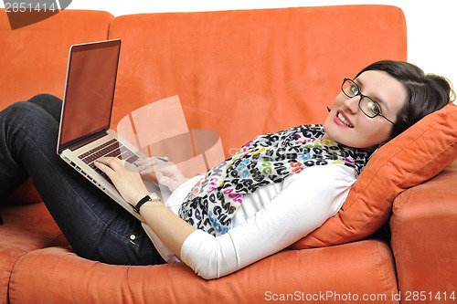 Image of woman using a laptop computer at home