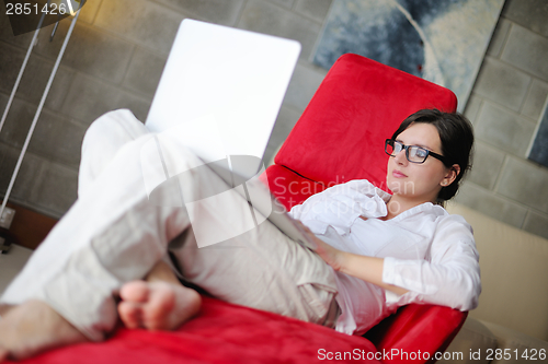 Image of woman using a laptop computer at home