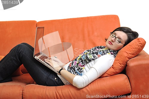 Image of woman using a laptop computer at home